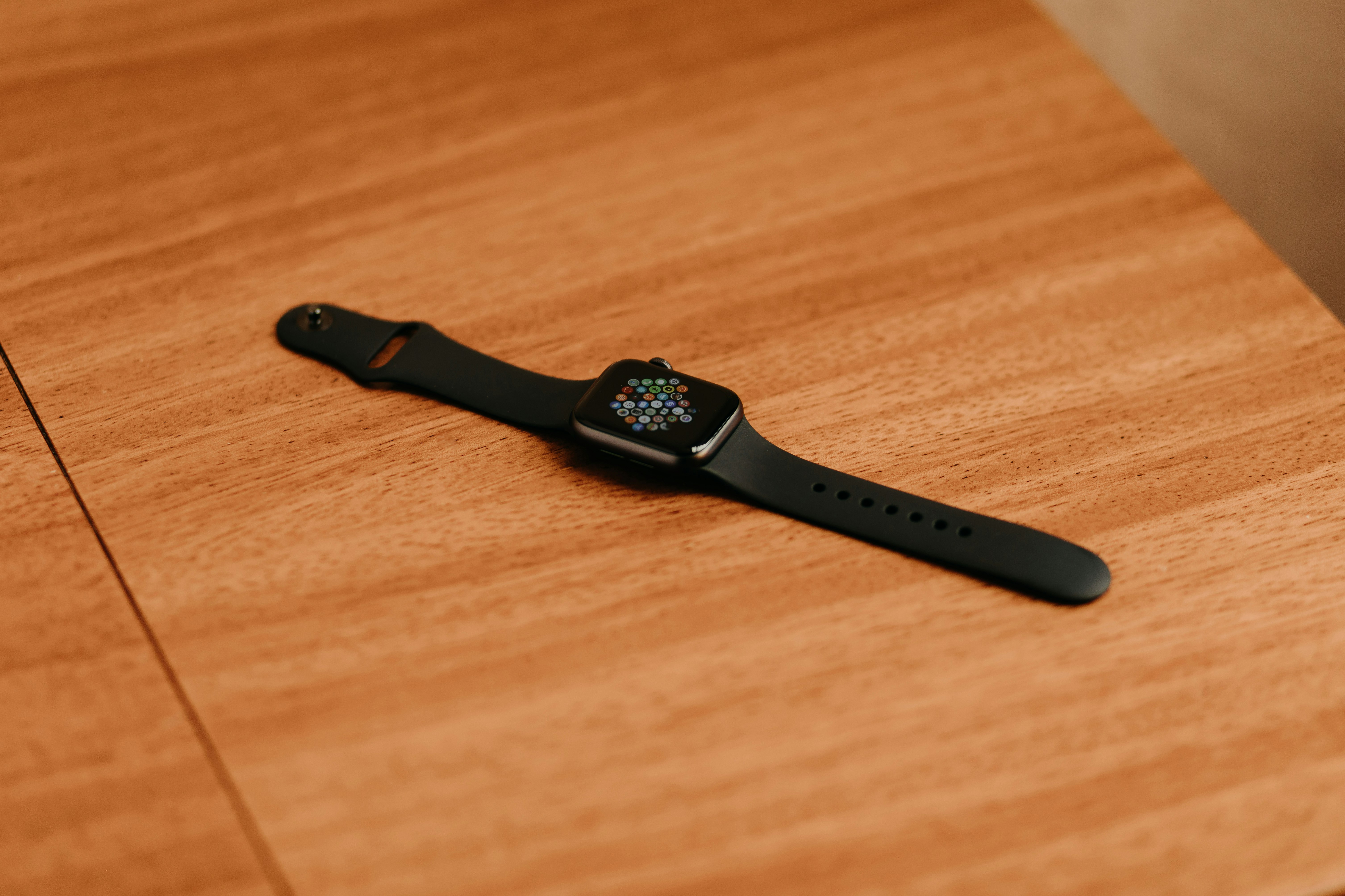 black apple watch with black sport band